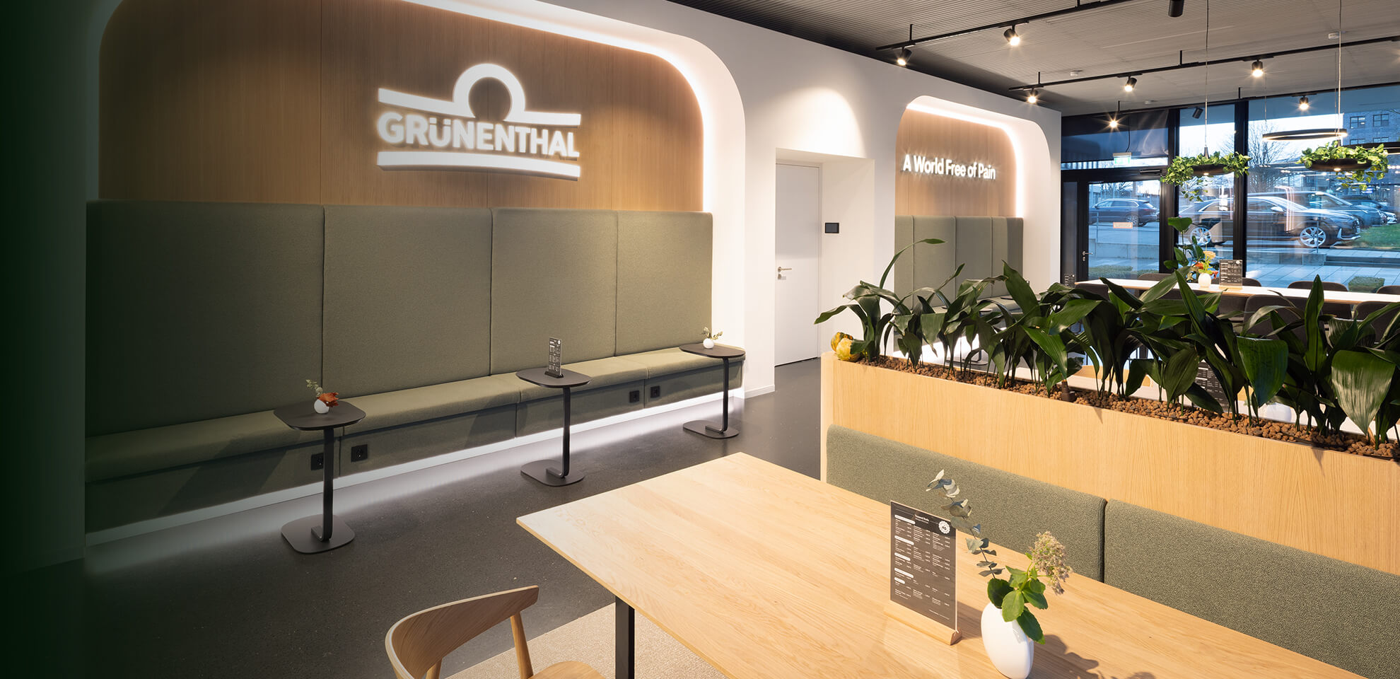 High-end office interior with open zones, barista bar and lounge areas, designed and built by Display International as interior design and fit-out partner.