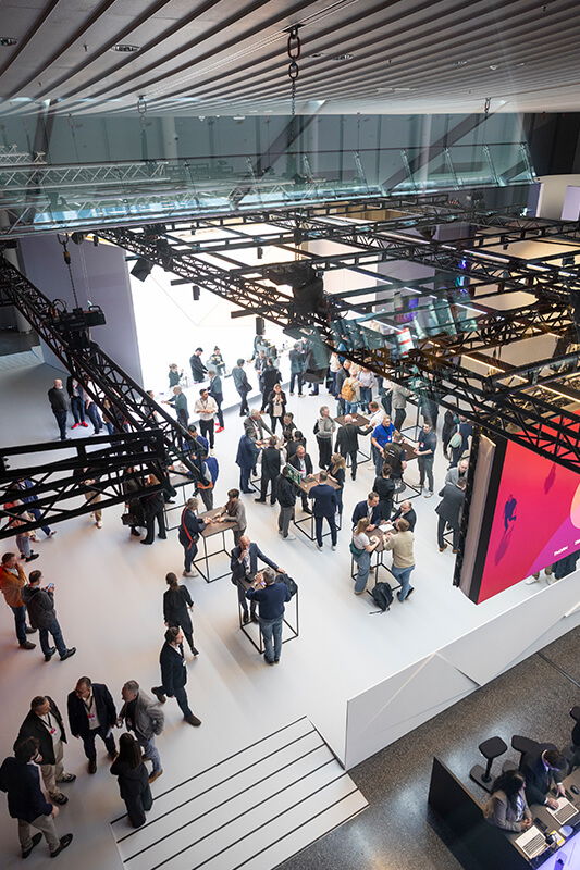 Visitors experience innovative lighting solutions at the Zumtobel exhibition stand at Light + Building Frankfurt.
